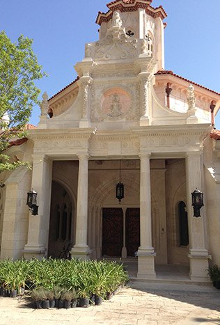 Classic iron entry doors mediterranean stone facade by Solara Custom Living