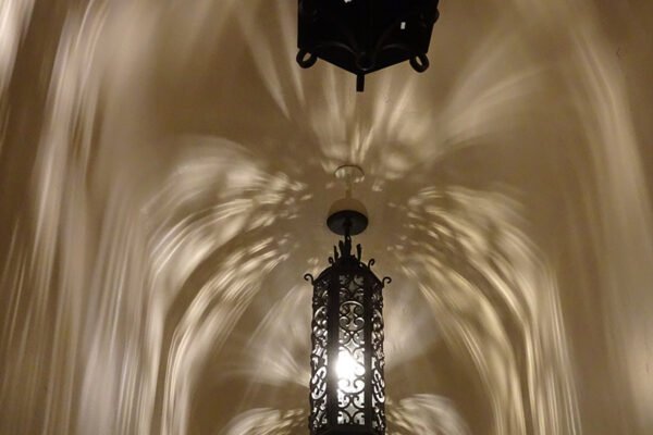 Classic iron lantern pendants vaulted hallway by Solara Custom Living