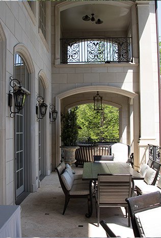 Classic iron wall sconces covered loggia by Solara Custom Living