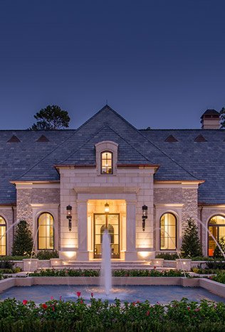 Classic steel doors outdoor lighting estate at dusk by Solara Custom Living
