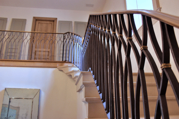 Custom steel arched stair railing curved by Solara Custom Living