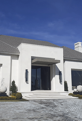 Low profile steel entry door remote access modern home by Solara Custom Living