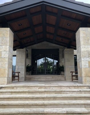 Low profile steel main entry door covered porch by Solara Custom Living