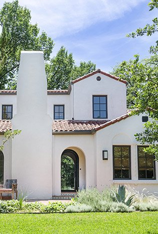 Low profile steel main entry door spanish home by Solara Custom Living