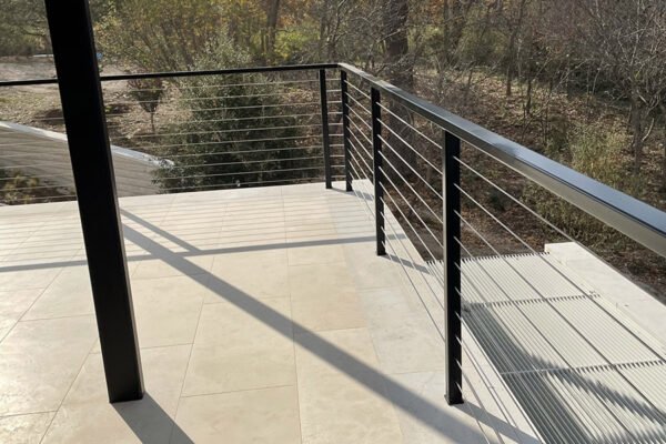 Modern steel cable railing terrace edge by Solara Custom Living