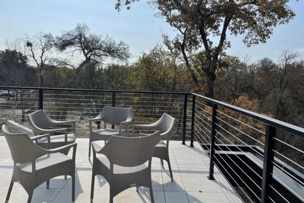 Modern steel cable railing terrace seating by Solara Custom Living