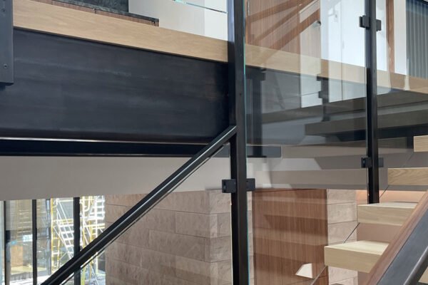 Modern steel glass railing floating staircase by Solara Custom Living