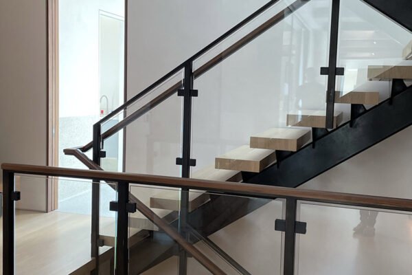 Modern steel glass railing floating stairs by Solara Custom Living