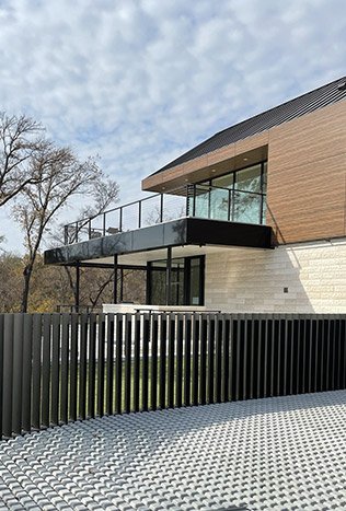 Modern steel railing cantilevered terrace by Solara Custom Living