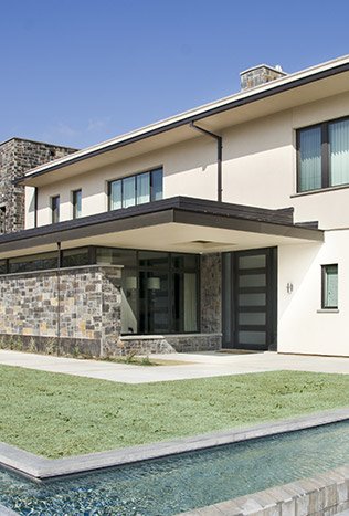 Modern steel windows doors reflecting pool by Solara Custom Living