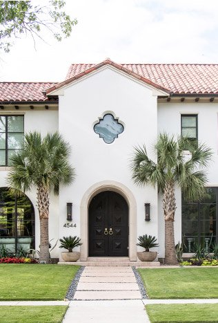 Transitional steel arched entry door quatrefoil facade by Solara Custom Living