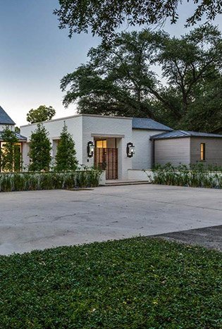 Transitional steel doors single story home by Solara Custom Living