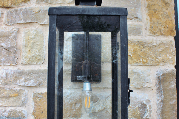 Transitional steel outdoor wall lantern stone by Solara Custom Living