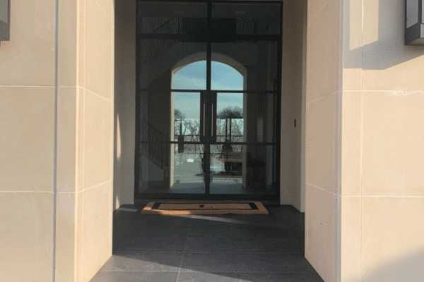 Jansen steel divided lite entry door arched vestibule by Solara Custom Living