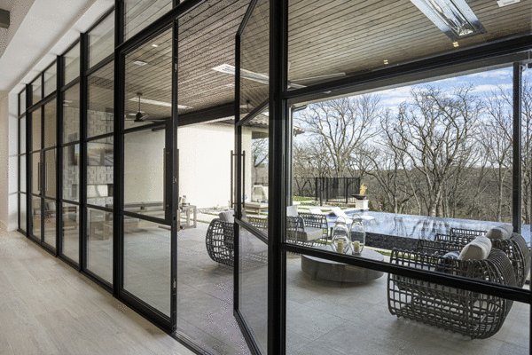 Jansen steel divided lite sliding doors covered patio by Solara Custom Living