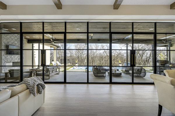 Jansen steel divided lite window wall living room by Solara Custom Living
